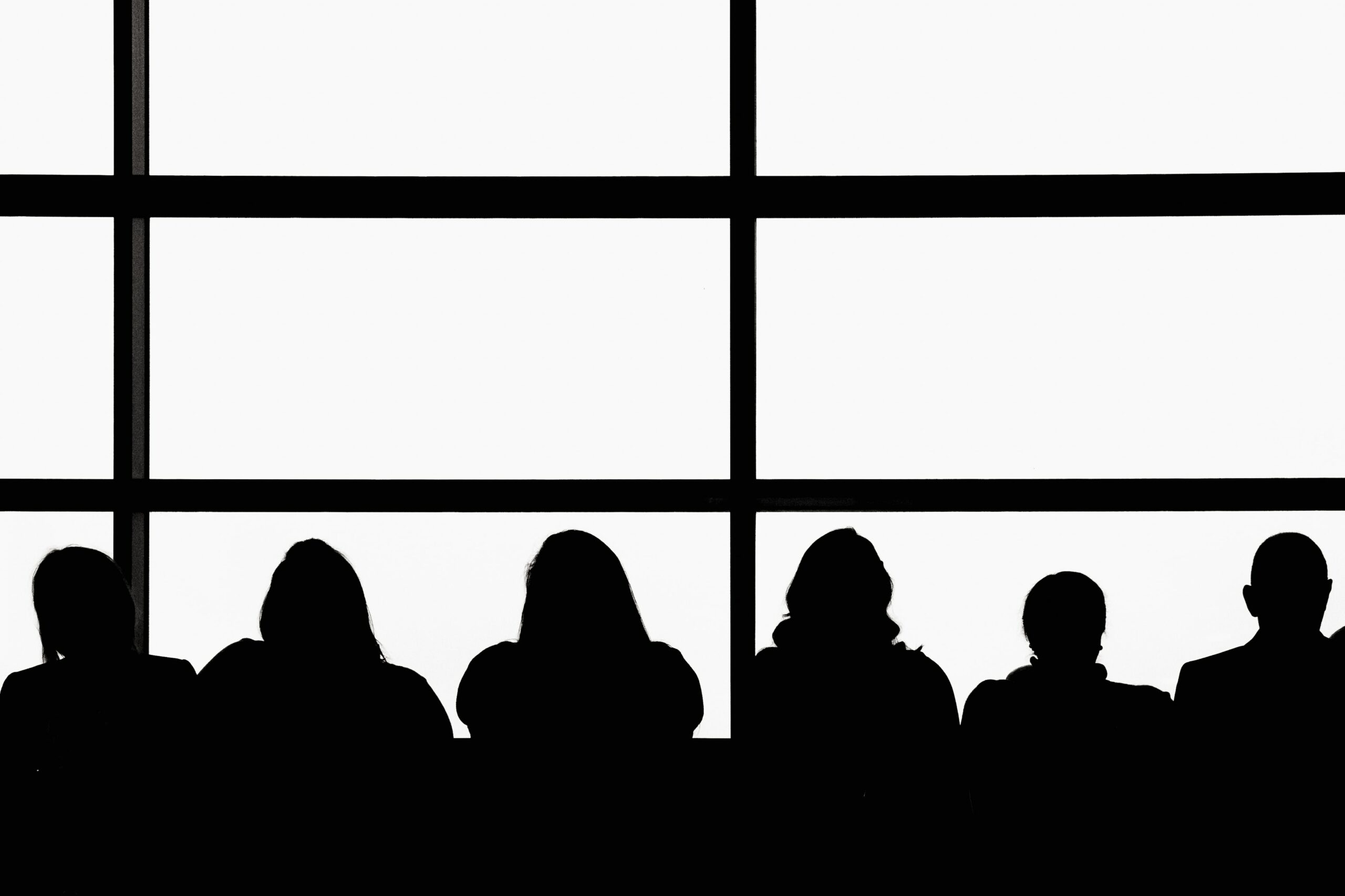 Silhouettes of six individuals