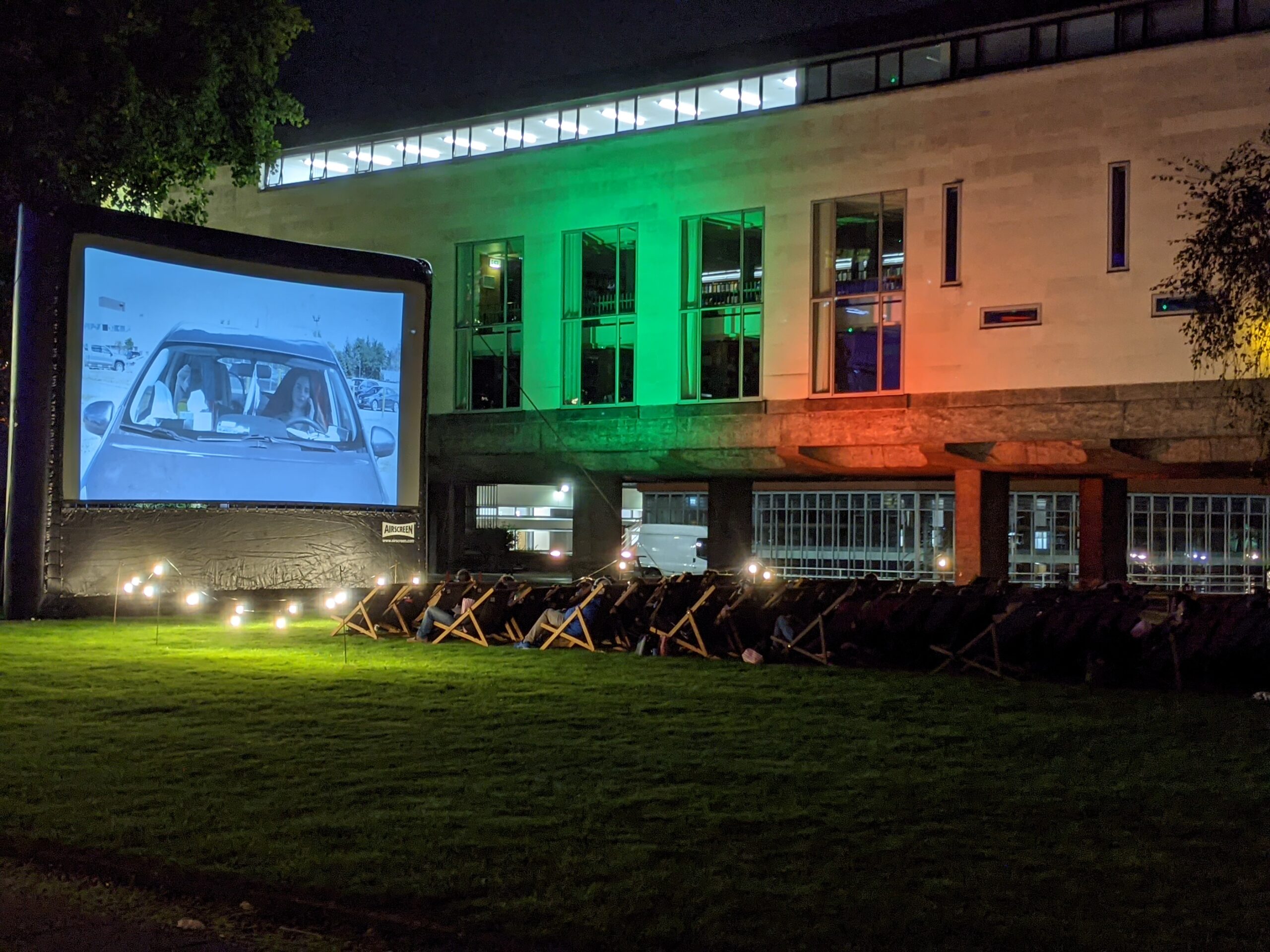 An image of deckchairs and a large screen at the CRASSH film festival.