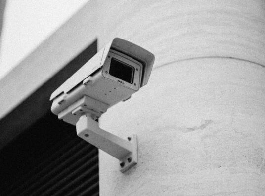 A black and white image of a CCTV camera