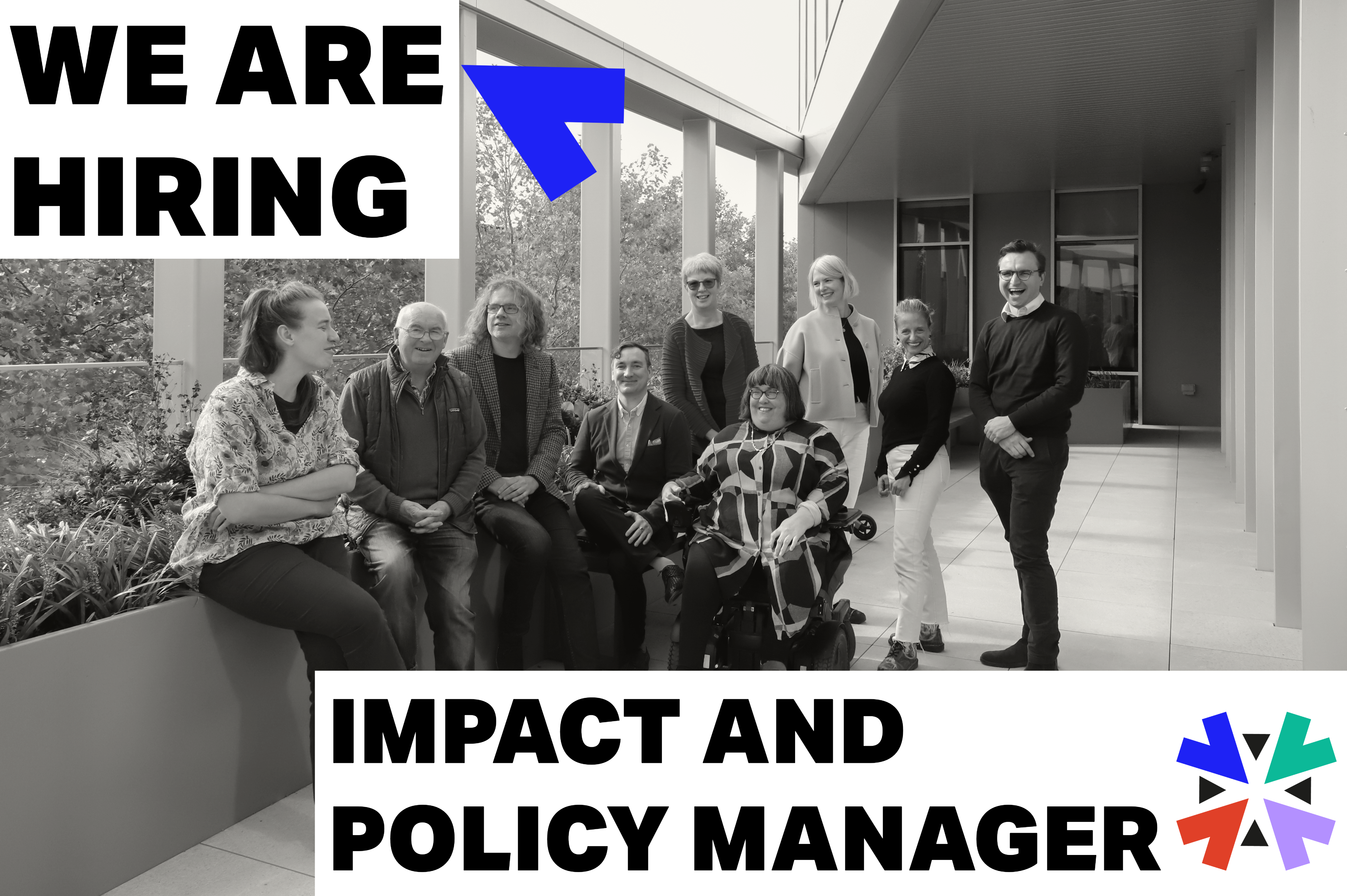 A black and white photo of members of the team standing in a corridor posing for a photo. Caption reads: we are hiring, impact and policy manager