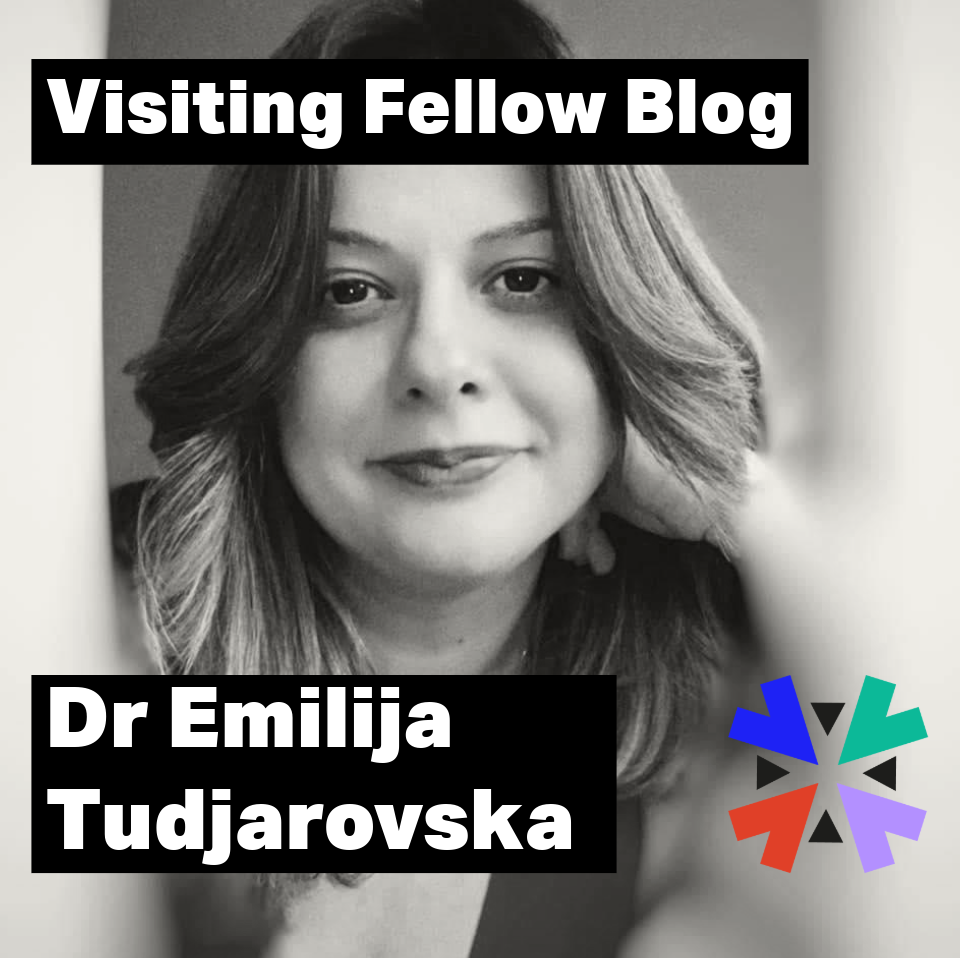 A black and white photo of Dr Emilija Tudzarovska - she has long hair and leaning her head on her hand.